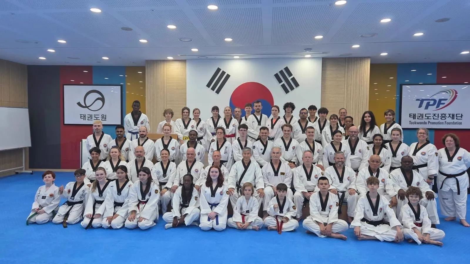 Large group of World Taekwondo Ireland students and Korean masters at a training camp in Korea